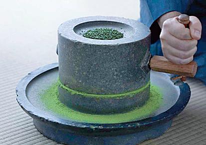 Grinding Matcha Green Tea Leaves into Powder