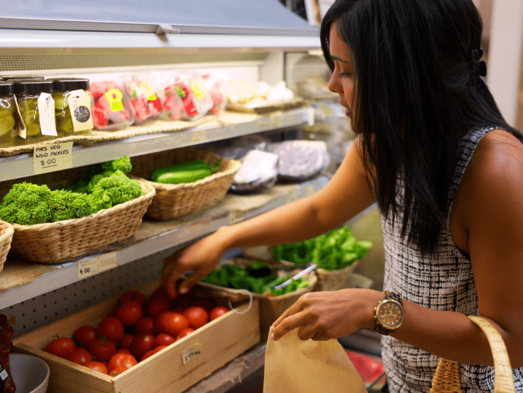 Kavisha shops fresh fruits and vegetables at the supermarket..